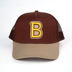 //merch.devolverdigital.com/cdn/shop/files/HLM_Trucker-cap_2_1024x1024.jpg?v=1692705280 Hotline Miami - Jacket "B" Trucker Cap