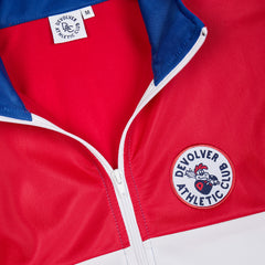 //merch.devolverdigital.com/cdn/shop/products/Trackie_Top_5---STORE_1024x1024.jpg?v=1659699501 DAC Track Top